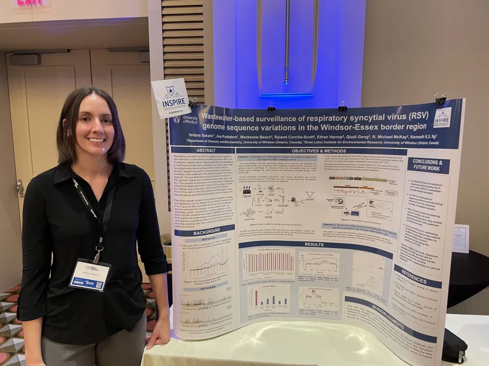 Isidora Sekaric standing next to her research poster on wastewater-based surveillance of RSV